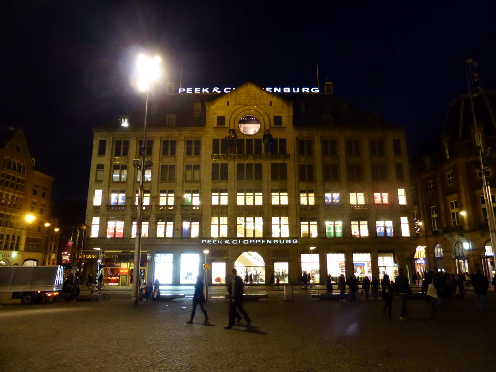 The Dam square with the building of the Peek & Cloppenburg department store and the Madame Tussaud museum, by night