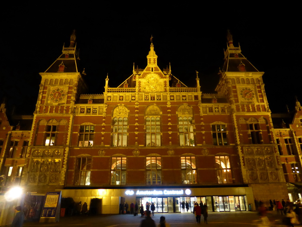 Front of the Amsterdam Centraal railway station at the Stationsplein square, by night