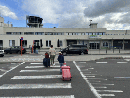 Miaomiao and Max in front of the entrance to Antwerp International Airport