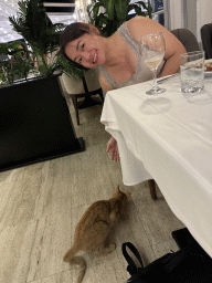 Miaomiao with a cat at the Panoramic Restaurant at the Rixos Downtown Antalya hotel