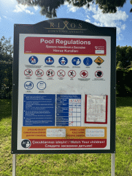 Sign with pool regulations at the swimming pool at the garden of the Rixos Downtown Antalya hotel
