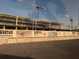 Front of a builing under construction at Antalya Airport, viewed from the taxi