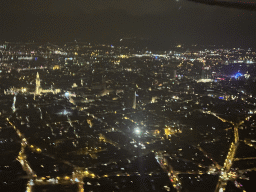 The city center of Antwerp with the Cathedral of Our Lady and a ferris wheel, viewed from the airplane to Antwerp, by night