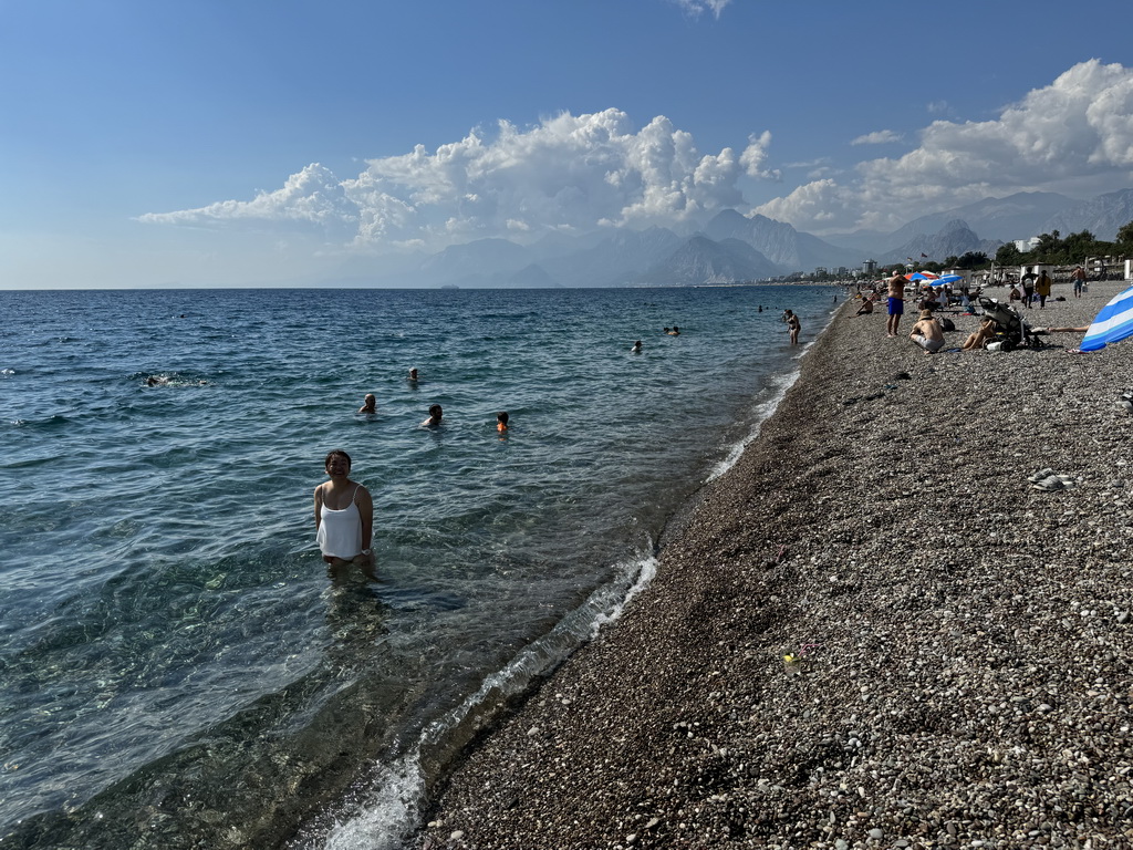 Miaomiao at the beach at the Beach Park, with a view on the Bey Mountains and the Gulf of Antalya