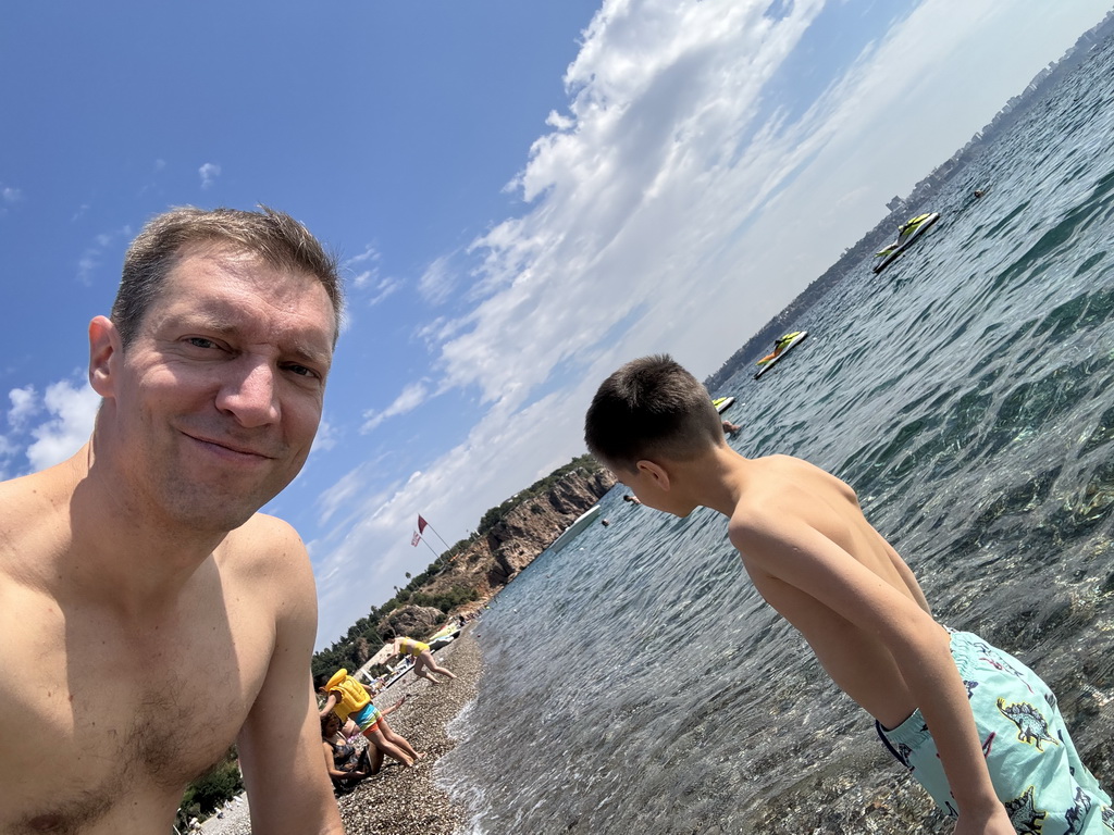 Tim and Max at the beach at the Beach Park, with a view on the city center and the Gulf of Antalya