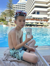 Max with a drink at the swimming pool at the garden of the Rixos Downtown Antalya hotel