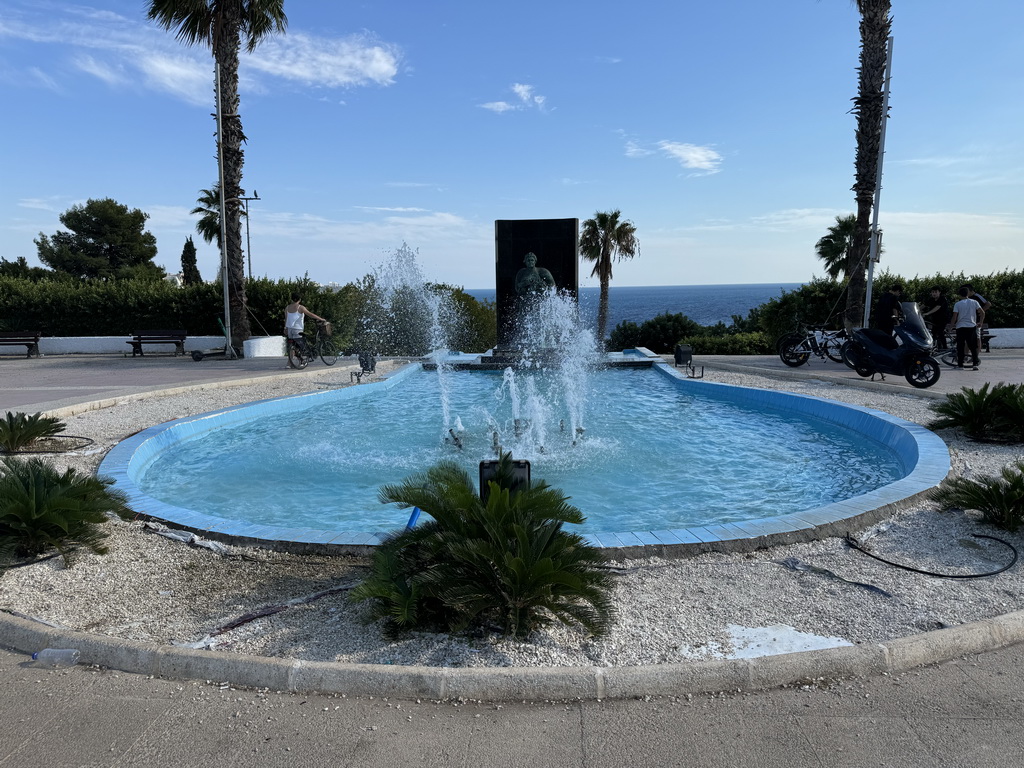 Miaomiao with her bicycle at the fountain at the center of the Atatürk Park