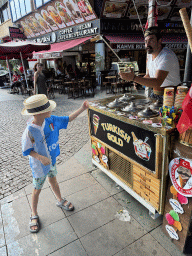 Max with an ice cream salesman at the Cumhuriyet Caddesi street