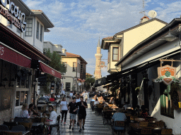Shops and restaurants at the Hesapçi Sokak alley and the minaret of the Sehzade Korkut Mosque