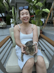 Miaomiao with a cat at the Tropic Bar at the garden of the Rixos Downtown Antalya hotel