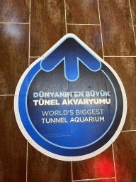 Sign on the floor of the World`s Biggest Tunnel Aquarium at the Ground Floor of the Aquarium at the Antalya Aquarium