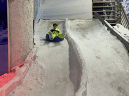 Max sliding down on a tyre at the Snow World at the Antalya Aquarium