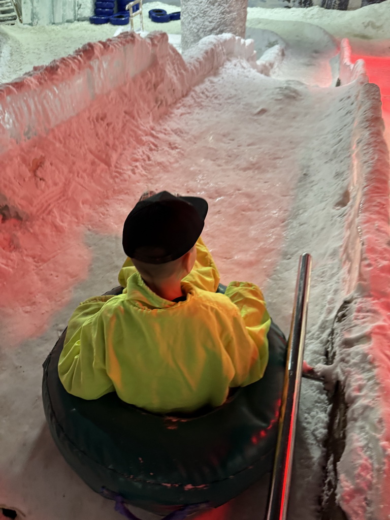 Max sliding down on a tyre at the Snow World at the Antalya Aquarium