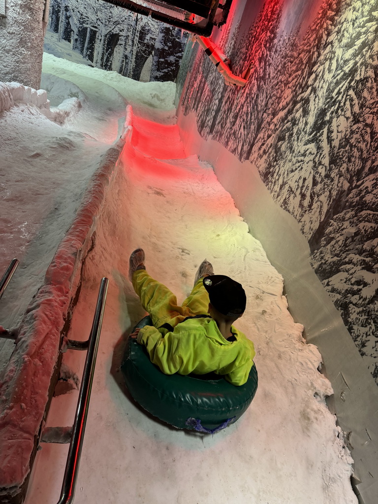 Max sliding down on a tyre at the Snow World at the Antalya Aquarium