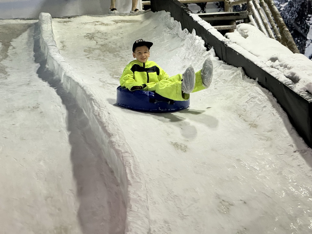 Max sliding down on a tyre at the Snow World at the Antalya Aquarium