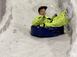 Max sliding down on a tyre at the Snow World at the Antalya Aquarium