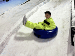 Max sliding down on a tyre at the Snow World at the Antalya Aquarium