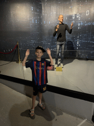 Max with a statue of Steve Jobs at the Face 2 Face Wax Museum at the Antalya Aquarium, with explanation