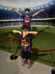 Max with a statue of Lionel Messi at the Face 2 Face Wax Museum at the Antalya Aquarium