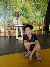 Max with a statue of Tom Hanks at the Face 2 Face Wax Museum at the Antalya Aquarium, with explanation
