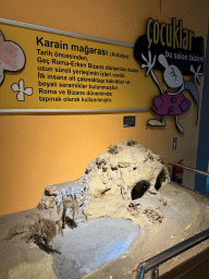 Scale model of the Karain Cave at the Children`s Section at the ground floor of the Antalya Archeology Museum, with explanation