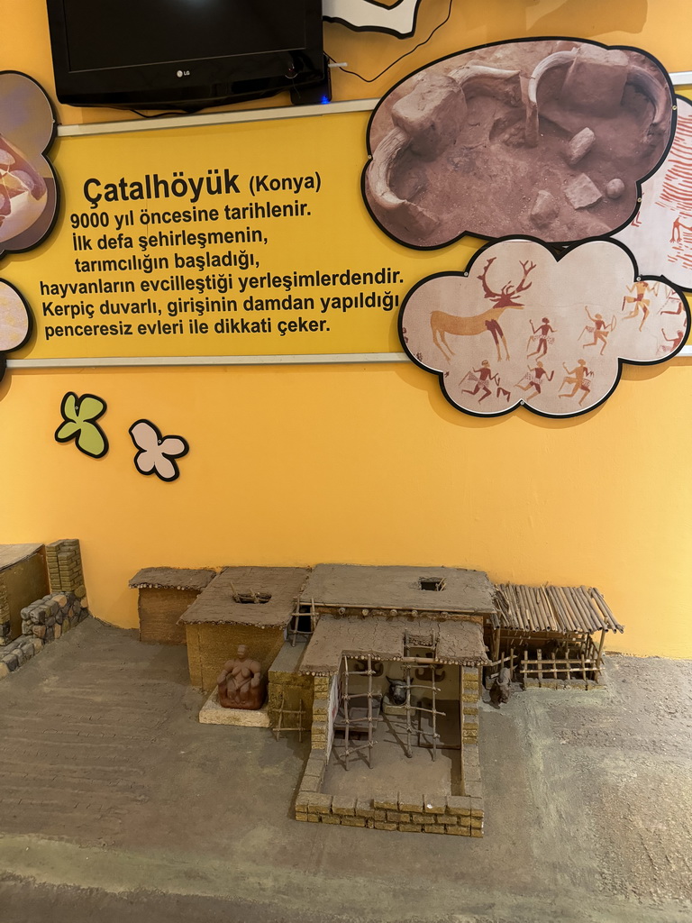 Scale model of a reconstruction of the Çatalhöyük archaeological site at the Children`s Section at the ground floor of the Antalya Archeology Museum, with explanation