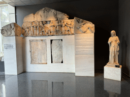 Statue, relief and tablets from the Ancient City of Perge at the Hall of the Cult of the Dead at the ground floor of the Antalya Archeology Museum, with explanation