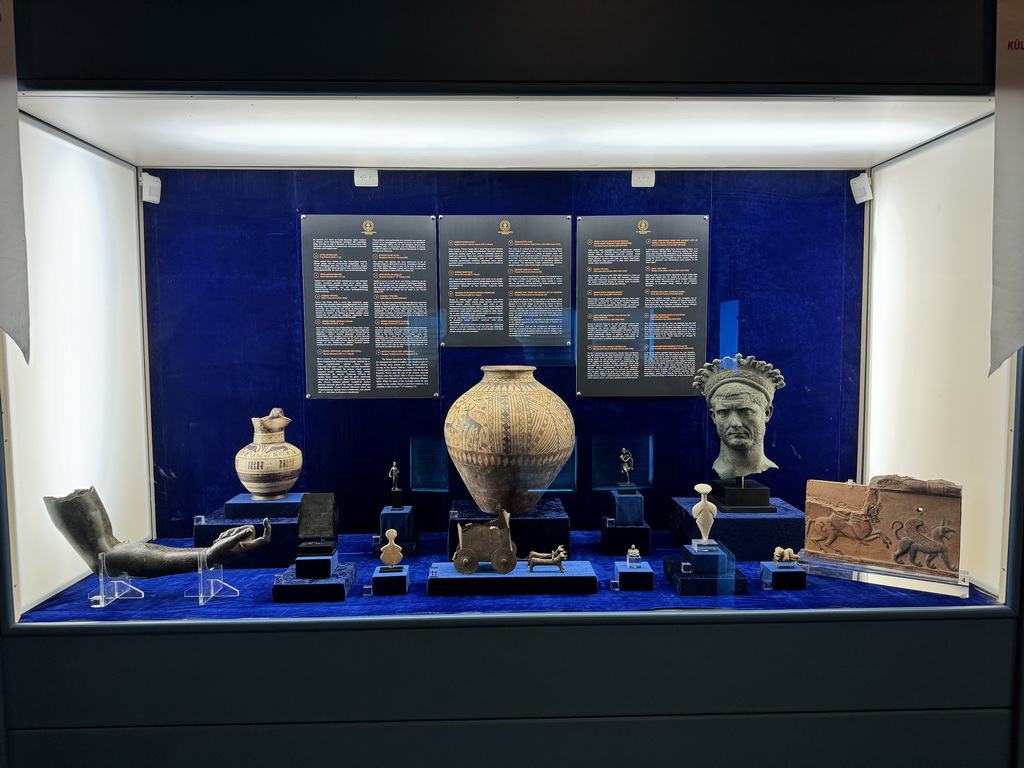 Vases, statuettes and other objects at the Small Objects Room at the upper floor of the Antalya Archeology Museum, with explanation