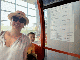 Miaomiao and Max at the Tünektepe Teleferik Tesisleri cable car, with information