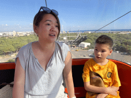 Miaomiao and Max at the Tünektepe Teleferik Tesisleri cable car, with a view on the parking lot at the Antalya Kemer Yolu road
