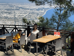 Miaomiao and Max at the terrace of the bar at the Tünektepe Teleferik Tesisleri upper station at the Tünek Tepe hill, with a view on the west side of the city, the city center and the Gulf of Antalya