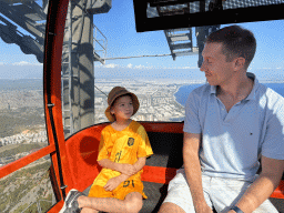 Tim and Max at the Tünektepe Teleferik Tesisleri cable car, with a view on the west side of the city, the city center and the Gulf of Antalya