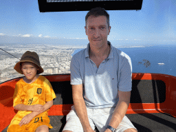 Tim and Max at the Tünektepe Teleferik Tesisleri cable car, with a view on the city center and the Gulf of Antalya