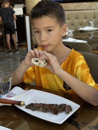Max eating kebab at the Halis Erzurum Cag Kebap Restaurant