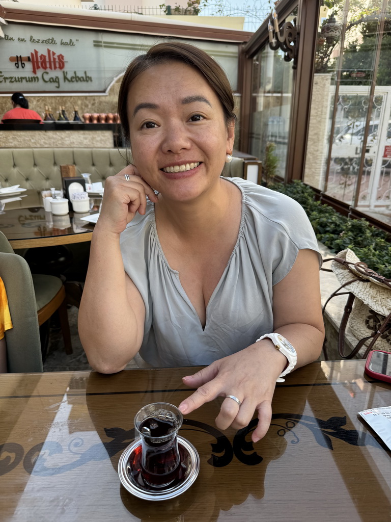 Miaomiao drinking Turkish tea at the Halis Erzurum Cag Kebap Restaurant