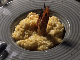 Risotto with saffron and shrimp at the terrace of the Turunc restaurant at the garden of the Rixos Downtown Antalya hotel, by night