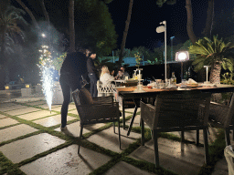 People celebrating a birthday at the terrace of the Turunc restaurant at the garden of the Rixos Downtown Antalya hotel, by night