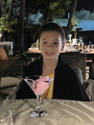 Max with an ice cream at the terrace of the Turunc restaurant at the garden of the Rixos Downtown Antalya hotel, by night