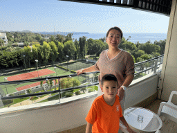 Miaomiao and Max at the balcony of our room at the Rixos Downtown Antalya hotel, with a view on the Sports fields, the city center and the Gulf of Antalya