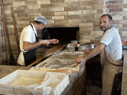 Cooks making a Turkish pizza at the Pasa Bey Kebap restaurant