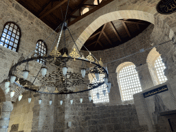 Chandeleers, windows and apse at the Sehzade Korkut Mosque