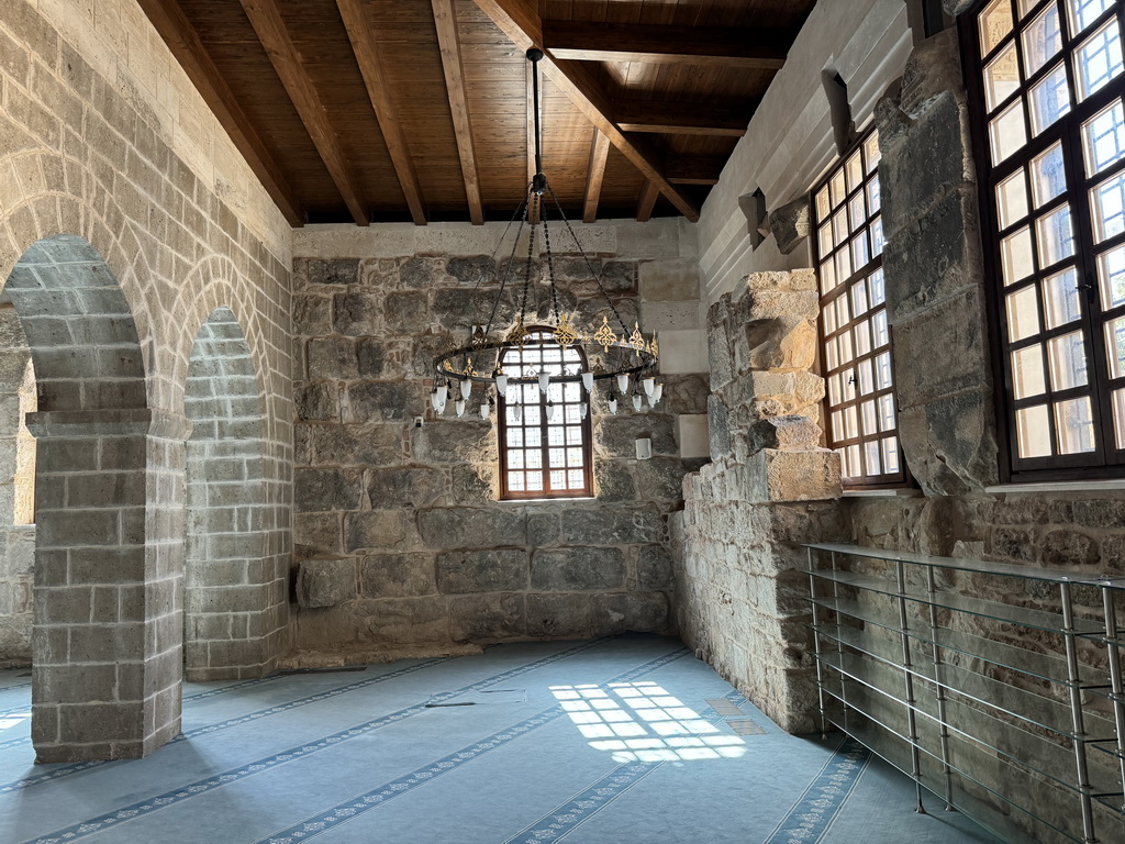 Arches, chandeleer and windows at the Sehzade Korkut Mosque