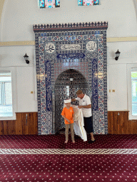 Imam and Max in front of the mihrab at the Imaret Camii mosque