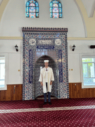 Tim in front of the mihrab at the Imaret Camii mosque