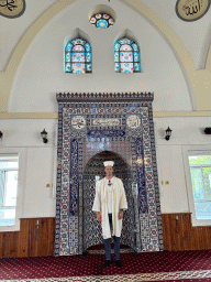 Tim in front of the mihrab at the Imaret Camii mosque