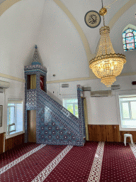 Minbar, chandeleer and stained glass window at the Sehzade Korkut Mosque
