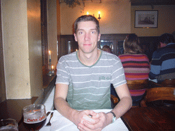 Tim with a Charles Quint beer at the De Valk restaurant