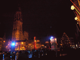 The Grote Markt square with the Brabo Fountain, an ice rink, christmas trees and the Cathedral of Our Lady, by night