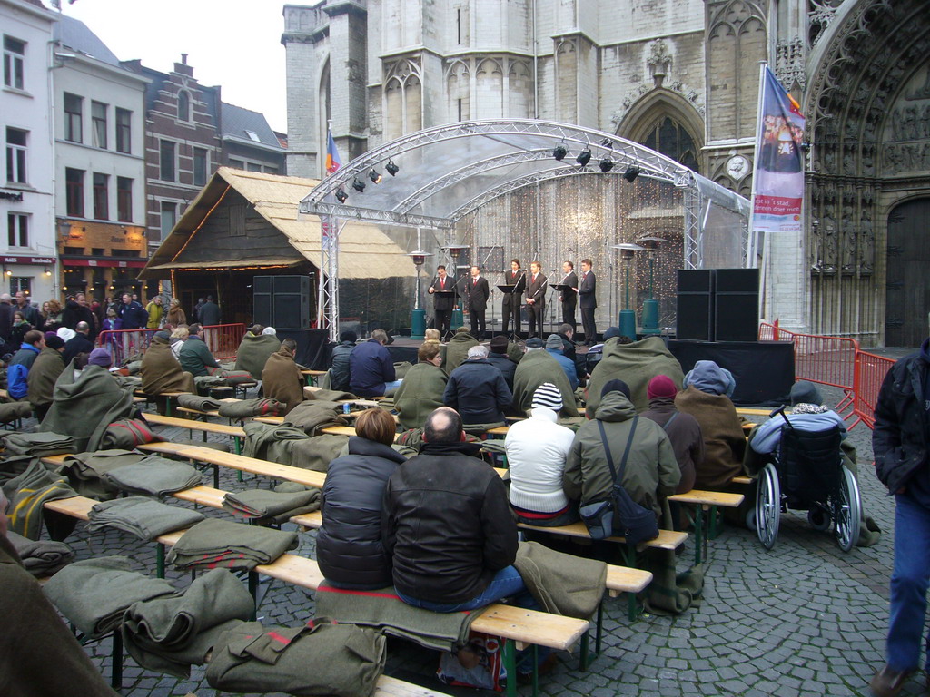 Christmas choir in front of the Cathedral of Our Lady at the Handschoenmarkt square