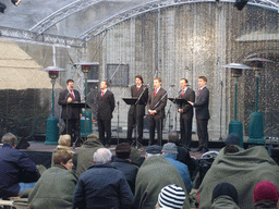 Christmas choir in front of the Cathedral of Our Lady at the Handschoenmarkt square